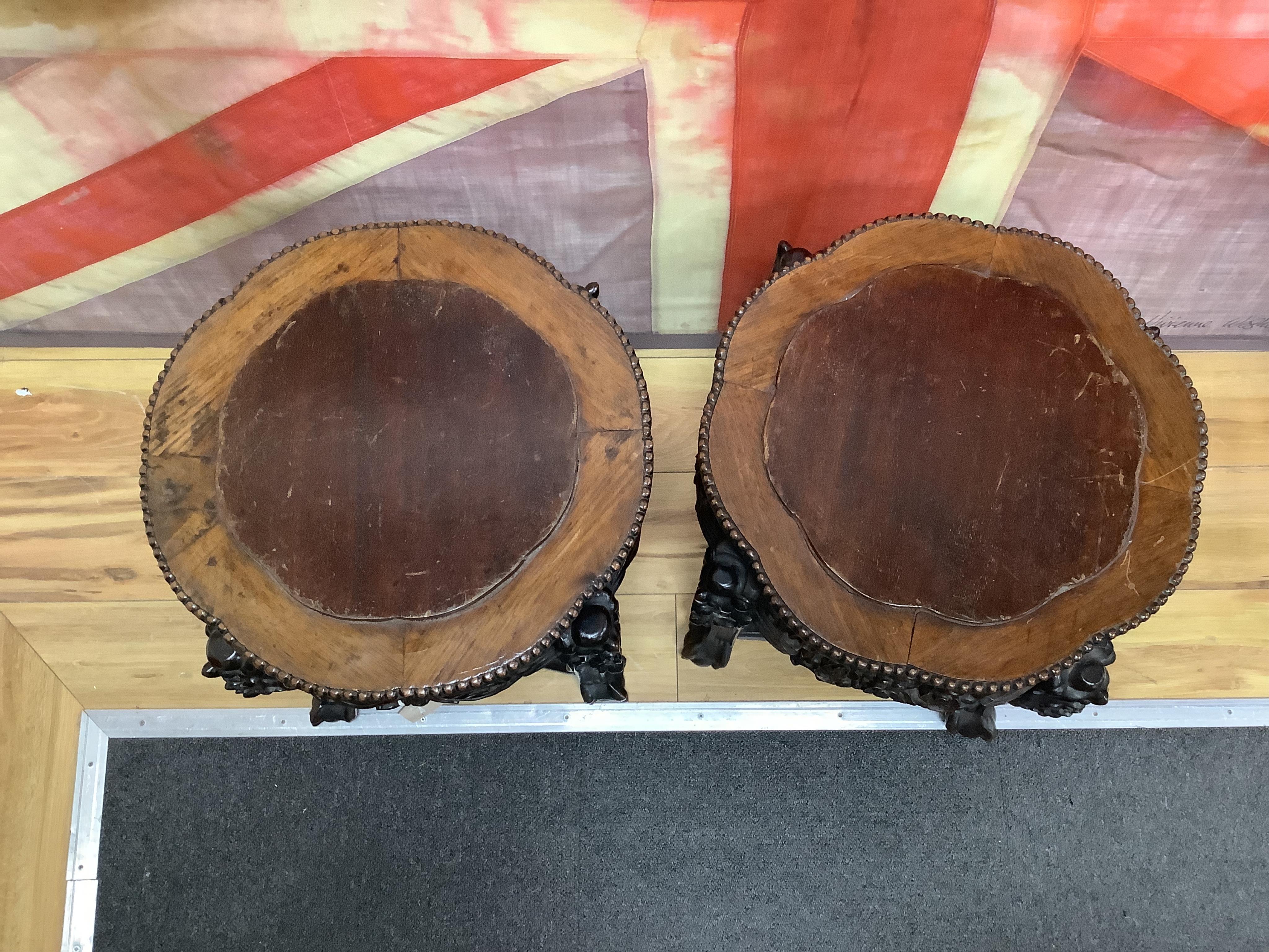 A pair of Chinese circular jardiniere stands with wood inset tops, diameter 46cm, height 46cm. Condition - fair